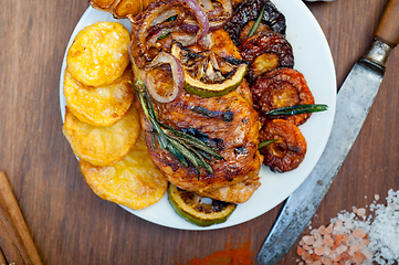 Image showing roasted grilled BBQ chicken breast with herbs and spices 