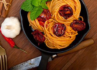 Image showing italian spaghetti pasta and tomato with mint leaves 