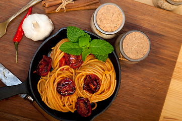 Image showing italian spaghetti pasta and tomato with mint leaves 