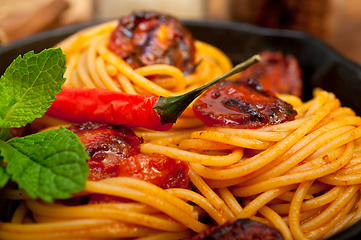 Image showing italian spaghetti pasta and tomato with mint leaves 