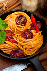 Image showing italian spaghetti pasta and tomato with mint leaves 