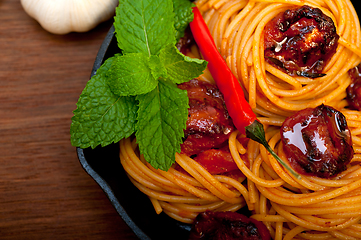 Image showing italian spaghetti pasta and tomato with mint leaves 