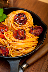 Image showing italian spaghetti pasta and tomato with mint leaves 