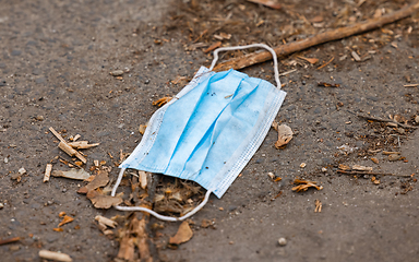 Image showing Discarded medical mask on the ground