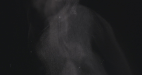 Image showing Steam rising from below against dark background