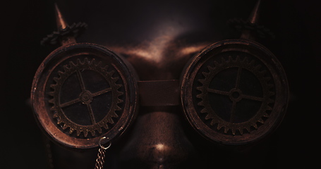 Image showing Dark steampunk mask enlighted close up footage