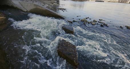 Image showing Large sewage tunnel with filth flowing out