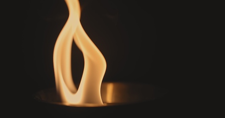 Image showing Fire dancing against dark background