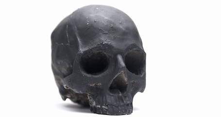 Image showing Dark skull rotating against white isolated background
