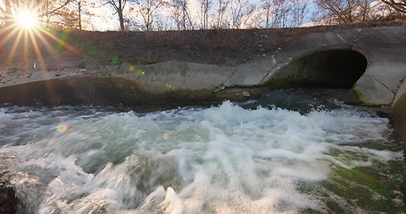 Image showing Large sewage tunnel with filth flowing out