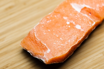 Image showing Slice of salmon on the table closeup