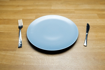 Image showing Empty dish on table with fork and knife