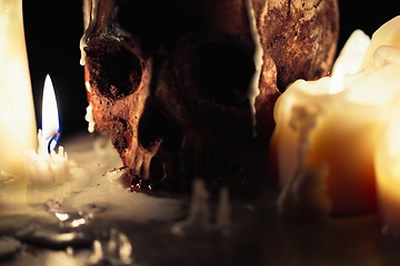 Image showing Human skull in candle light closeup