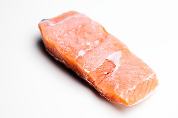 Image showing Slice of salmon against isolated white background closeup