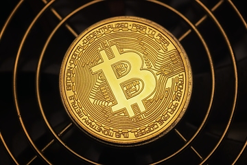 Image showing Physical shiny bitcoin agains dark background