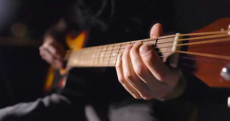 Image showing Playing on the guitar closeup footage