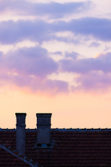 Image showing Sky at dawn with chimney and house