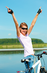 Image showing Young woman raised her hands up in joy