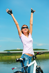 Image showing Young woman raised her hands up in joy