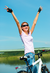 Image showing Young woman raised her hands up in joy