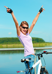 Image showing Young woman raised her hands up in joy