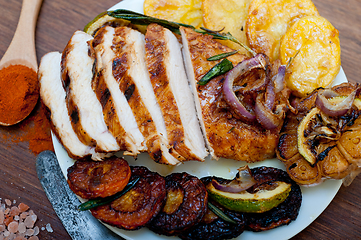 Image showing roasted grilled BBQ chicken breast with herbs and spices 