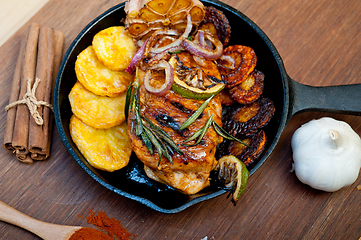 Image showing roasted grilled BBQ chicken breast with herbs and spices 