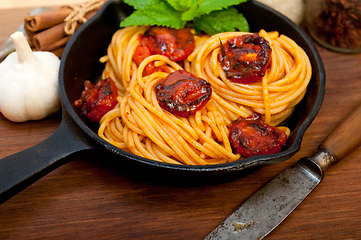 Image showing italian spaghetti pasta and tomato with mint leaves 