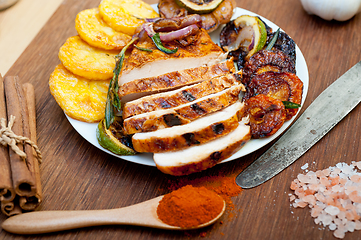 Image showing roasted grilled BBQ chicken breast with herbs and spices 