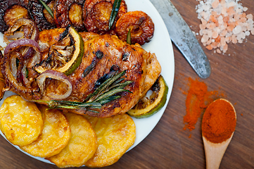 Image showing roasted grilled BBQ chicken breast with herbs and spices 