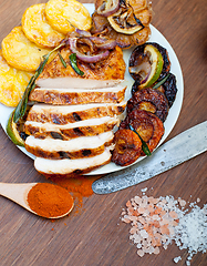 Image showing roasted grilled BBQ chicken breast with herbs and spices 