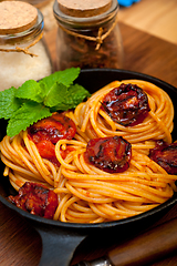 Image showing italian spaghetti pasta and tomato with mint leaves 