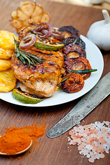 Image showing roasted grilled BBQ chicken breast with herbs and spices 