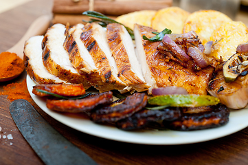 Image showing roasted grilled BBQ chicken breast with herbs and spices 