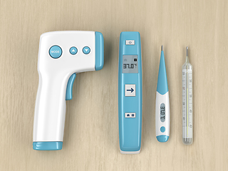 Image showing Medical thermometers on wood table