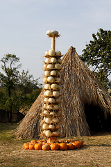 Image showing Ripe autumn pumpkins arranged on totem in farm