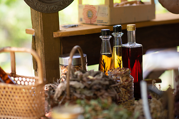 Image showing potion bottle in hand of herbalist