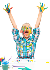 Image showing Little girl is rising her hands up in joy