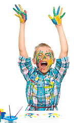 Image showing Little girl is rising her hands up in joy