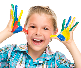 Image showing Portrait of a cute girl playing with paints