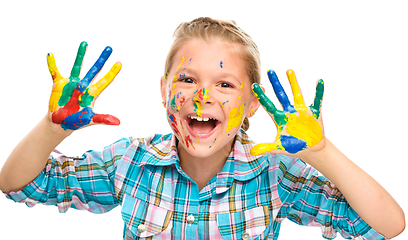 Image showing Portrait of a cute girl playing with paints