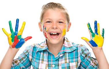 Image showing Portrait of a cute girl playing with paints