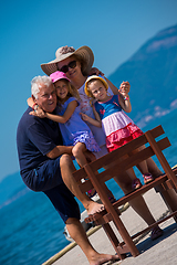 Image showing portrait of grandparents and granddaughters by the sea