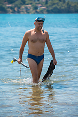 Image showing fisherman preparing for underwater fishing