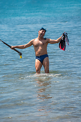 Image showing fisherman preparing for underwater fishing