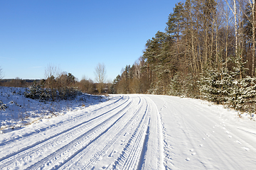 Image showing rural road covered with snow closeup