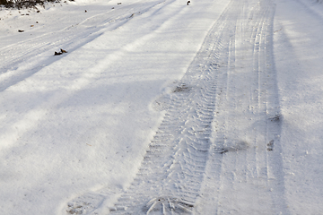 Image showing traces of the wheels of the car on the snow-covered road