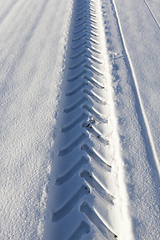 Image showing Tire tracks on snow