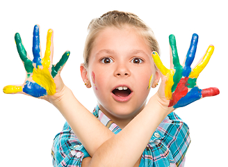 Image showing Portrait of a cute girl playing with paints