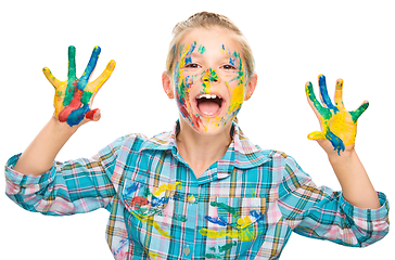 Image showing Portrait of a cute girl playing with paints